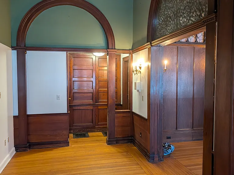 Entryway with linen storage, coat closet and half-bath