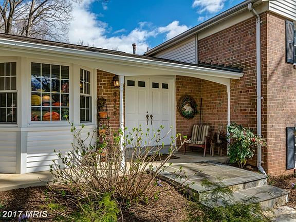 Charming front porch and double door entry