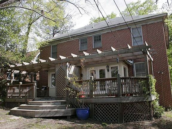 BACK OF HOUSE with a Deck & Pergola