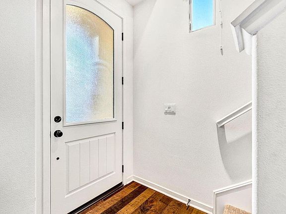 Front door from inside. Bedroom and on suite bathroom located on this level.