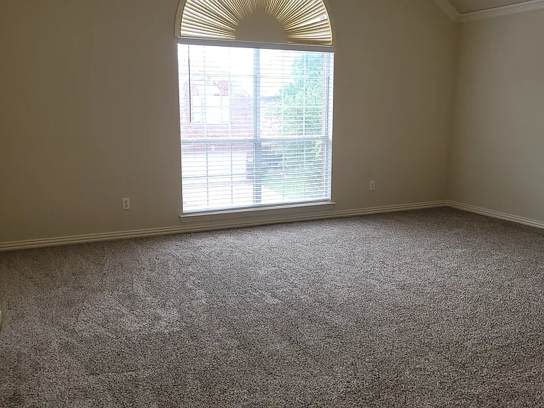 primary bedroom with high ceilings