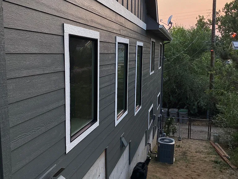 View looking towards the alley from the north east corner of house.