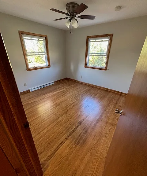 Bedroom 1 with freshly varnished hardwood floor