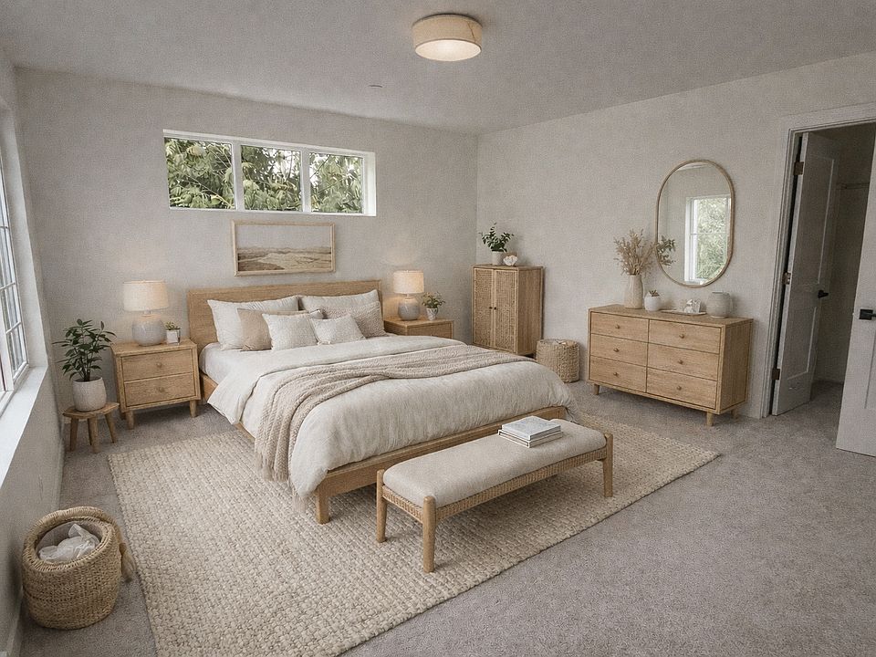 Primary bedroom with walk in closet and private bathroom