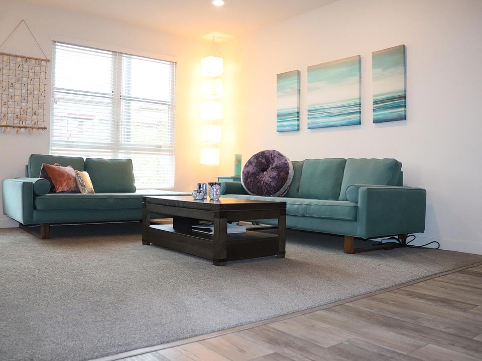Living room offers seating for over 6 people, that flows into the open floor plan.