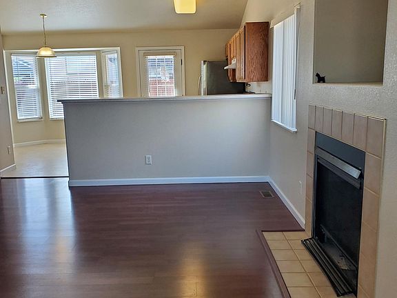 Living room, in the background kitchen and large dining area