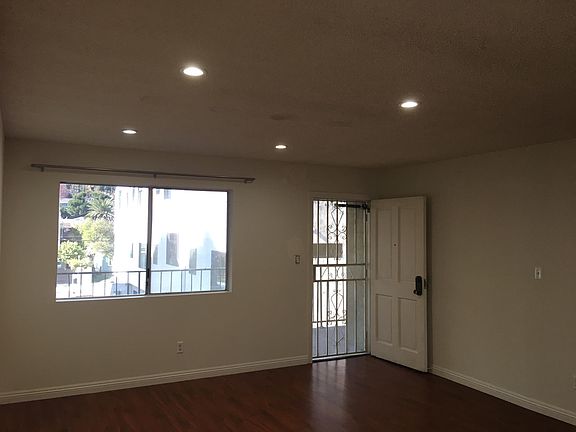 Entrance - Wooden door and a screen door for security.