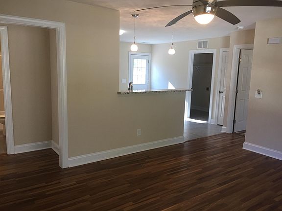 Open floor plan with gorgeous hardwoods