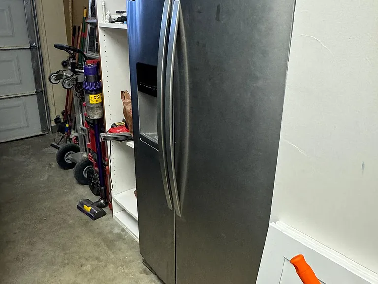 extra fridge/freezer combo in garage.