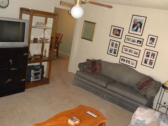 large living room with new carpet throughout house