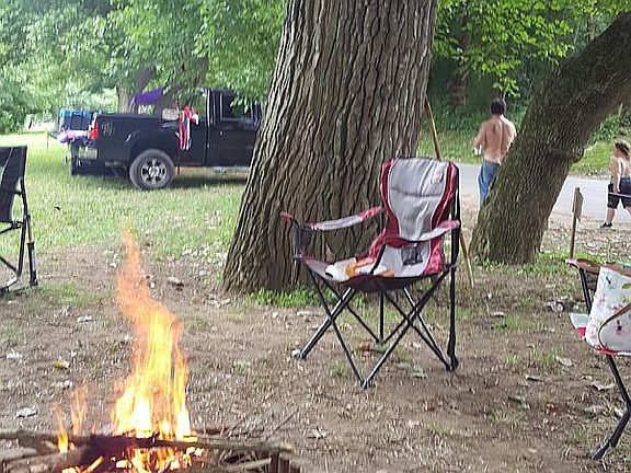 Campfire on waterfront side.
