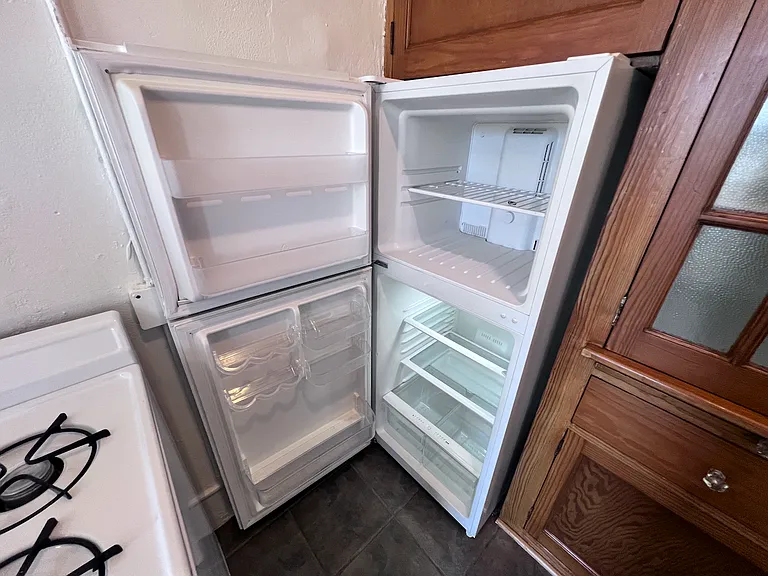 Refrigerator and freezer fits snugly into the built in cabinetry.