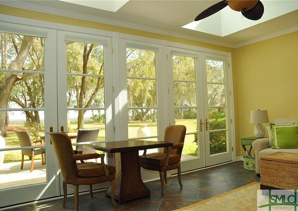 Sunroom opens to the deck and has beautiful views!