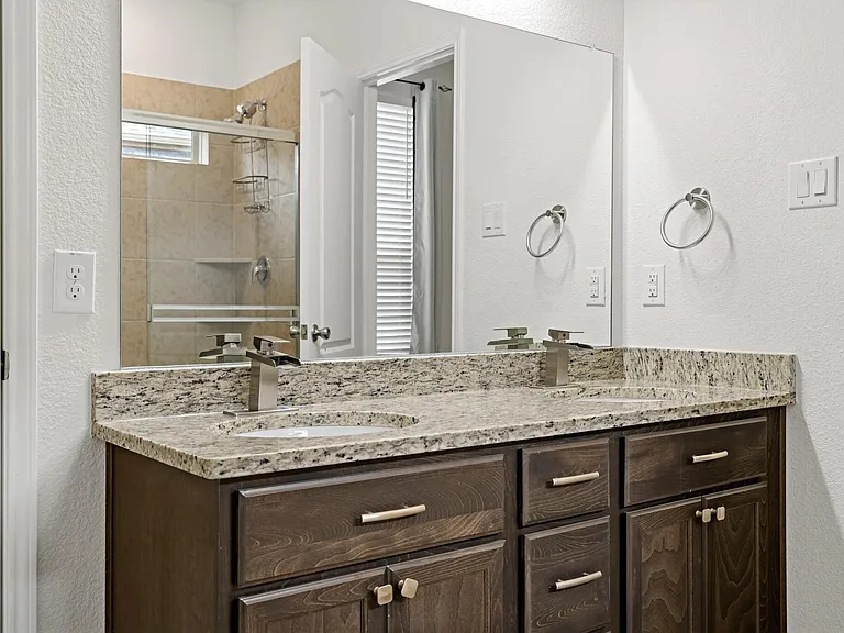 Primary bathroom with dual vanities