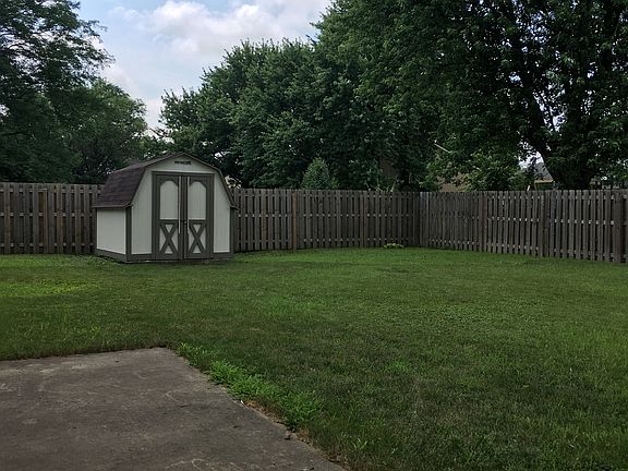 Fenced in backyard & shed.