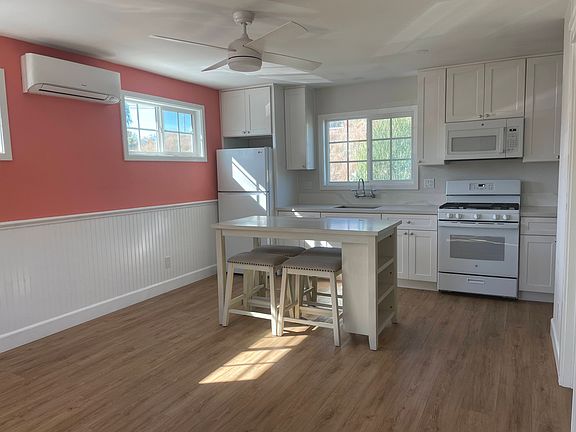 Enter into Living Space and Kitchen. Ceiling Fan, Mini-Split A/C and heater. Hard Floors, Wainscoting.
