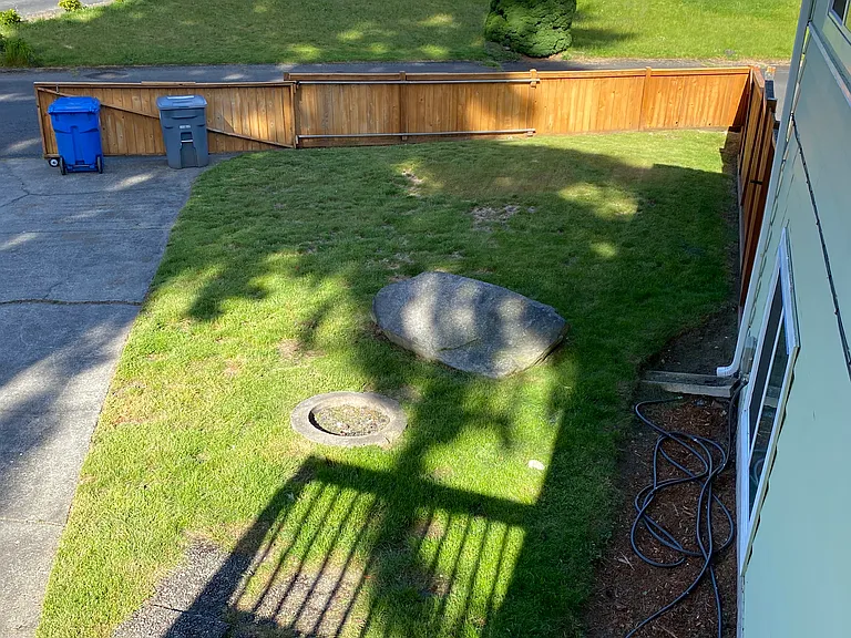 Large backyard with gate.