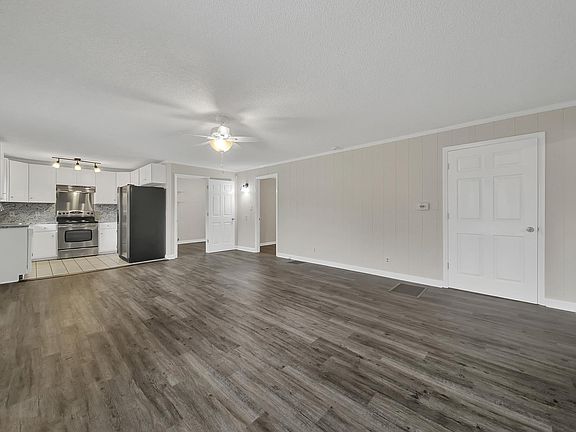 Large living area. Entire house has new floors, new doors, and entirely painted. Kitchen is completely remodeled.