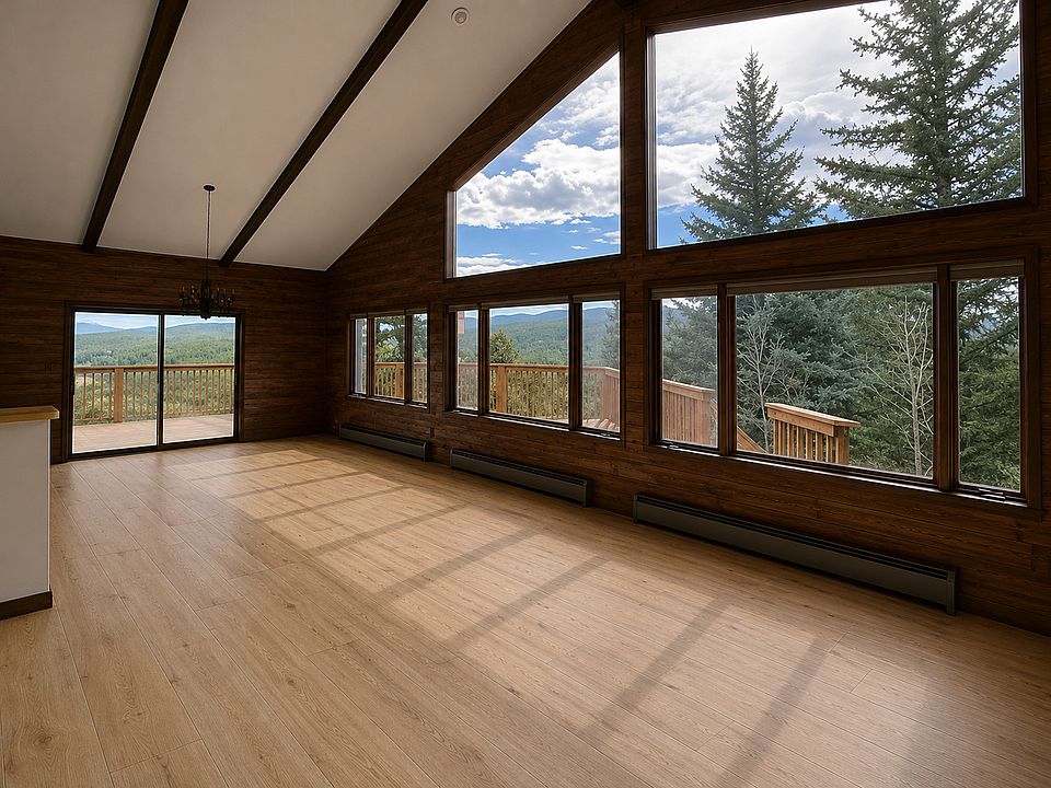Views to the mountains from living and dining rooms. Brand new Luxury Vinyl Plank floors. Photo is digitally altered to show flooring update (original photos were taken prior to the floors install).