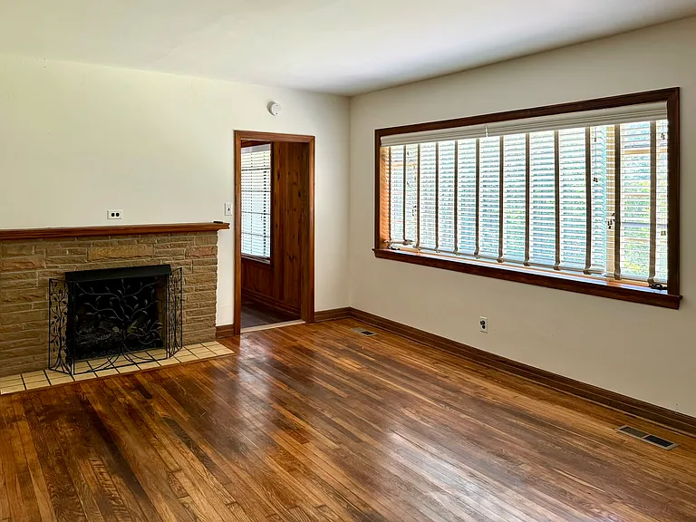 Living Room. Remote control gas fireplace next to entry into Den.