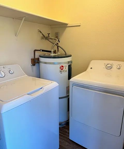 Full sized washer and dryer in separate in-unit laundry room.