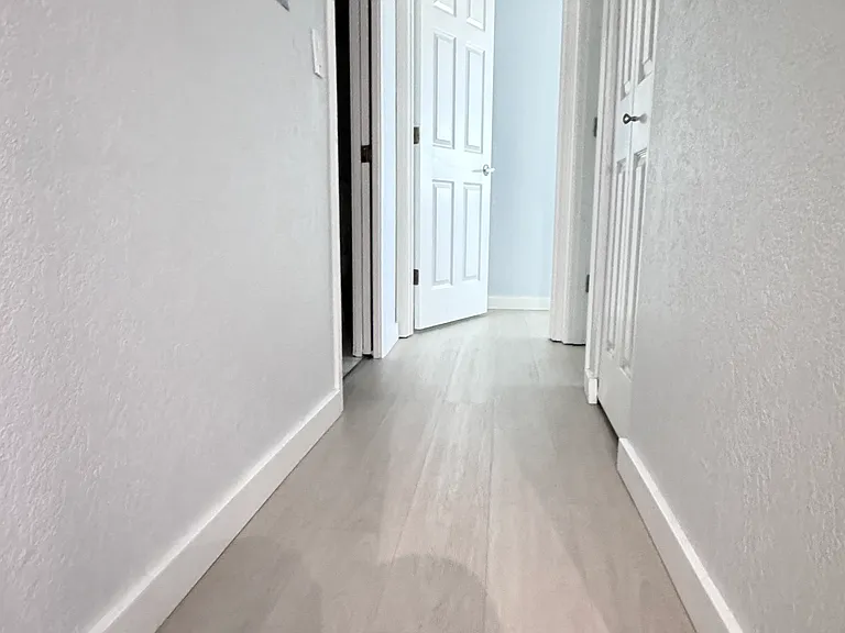 Aisle to bedroom and bathrooms