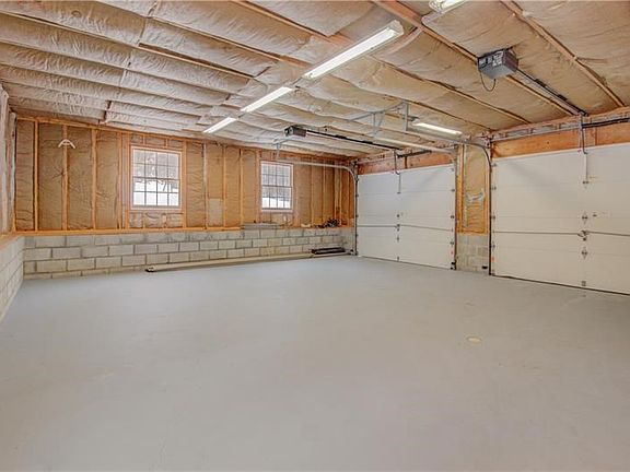 Two car garage - 24x26 fully insulated.  Plenty of space for two cars and storage. Service door to concrete patio. Hot and cold 