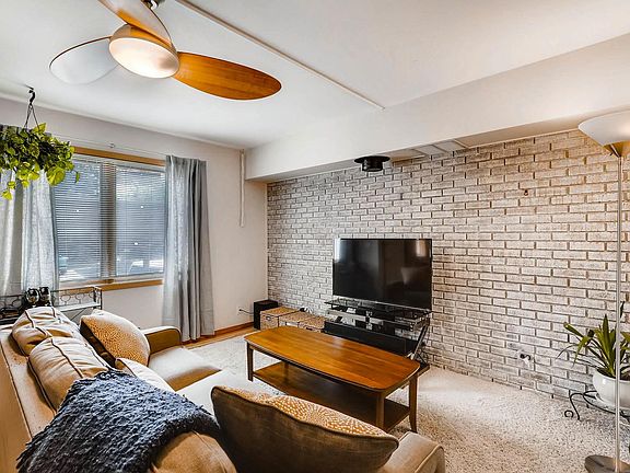 Living room - exposed brick and ceiling fan