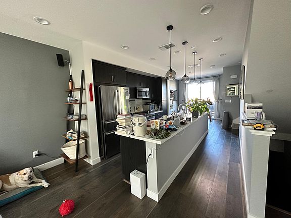 Kitchen has a huge island with quartz counterop