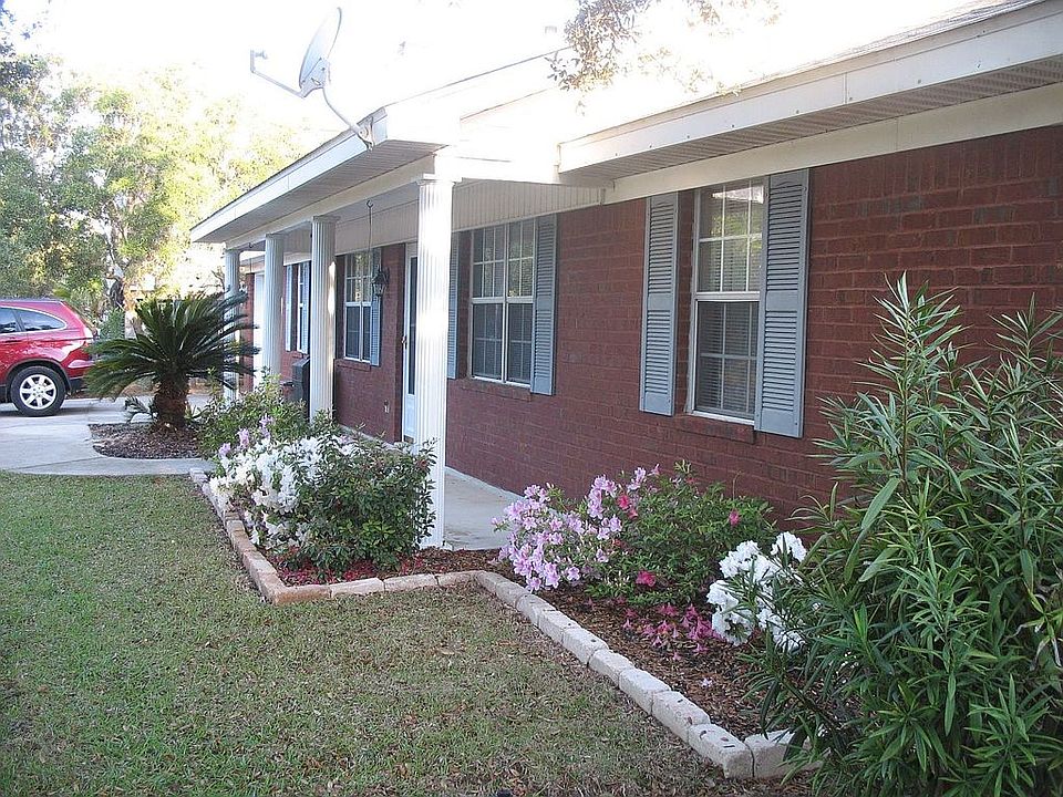 Front before 3 car carport 