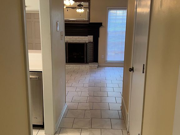 Hall from living room into den.
Tile floors for easy maintenance