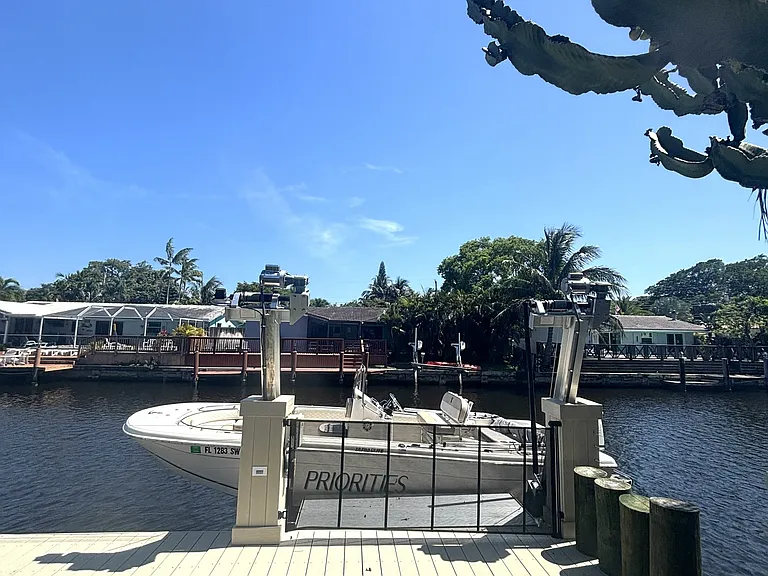Boat lift installed 2024 up to 10,000lbs. Installed with a safe step to get on and off the boat. On the other side of the dock is a floating dock and ladder to use paddleboards or a kayak!