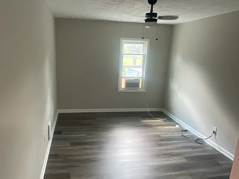 Large bedroom 1 of 2 with new luxury vinyl plank
