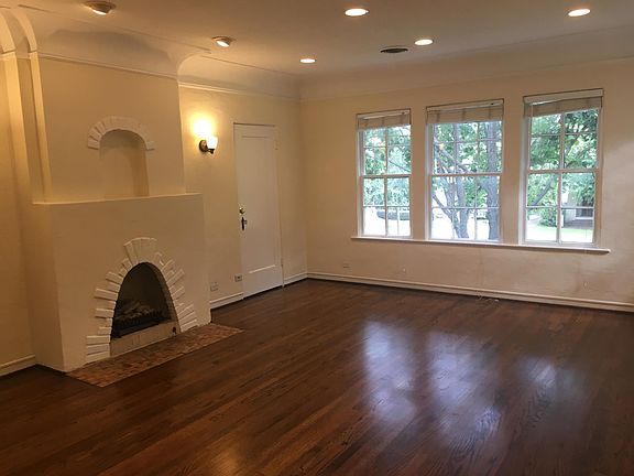 Charming stucco fireplace and large storage closet