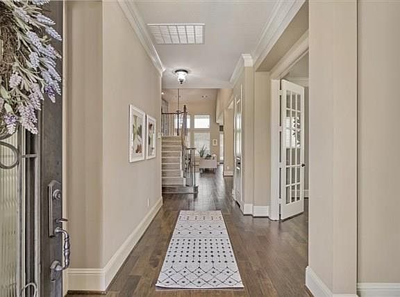 A very welcoming entry from your wood front door with glass insert and iron detail. Opens up to the foyer with beautiful hard woods throughout the living area.