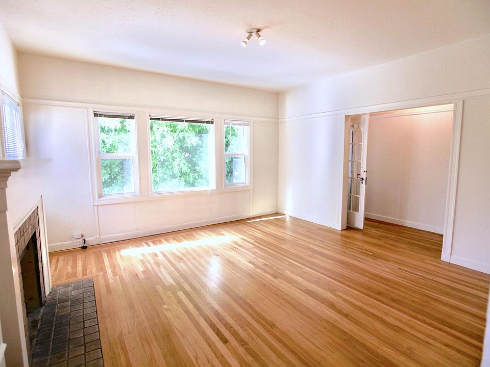 LIVING ROOM WITH DECORATIVE FIREPLACE & OFFICE ALCOVE