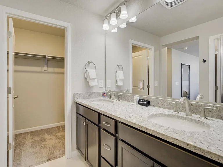 Master En-Suite
Attached bath with dual vanities, walk-in shower and walk-in closet.