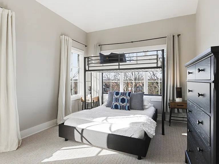 Bedroom 3 with a full over queen bunk bed, ensuite bathroom, and dresser for your belongings. Also includes a walk-in closet. Located on the 3rd floor.