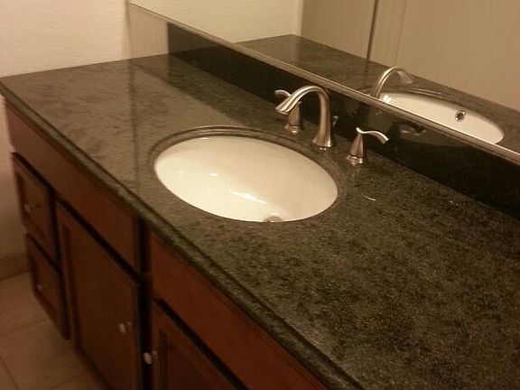 Bathroom vanity. Granite top.