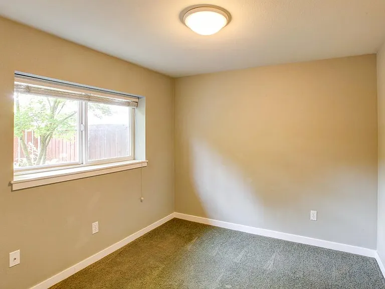 Lower Bedroom with views of the front yard garden