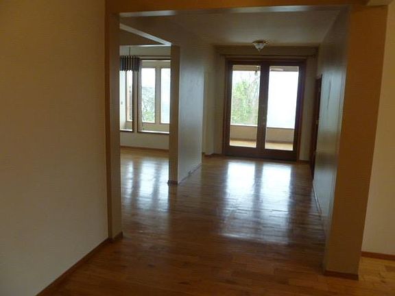 French doors open to enclosed porch