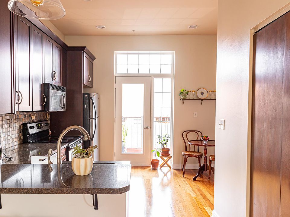 Kitchen with access to private balcony