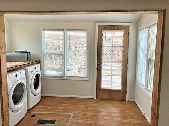 Sunny room extends from living area into back yard