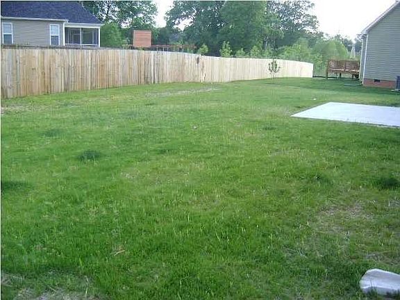 level fenced back yard