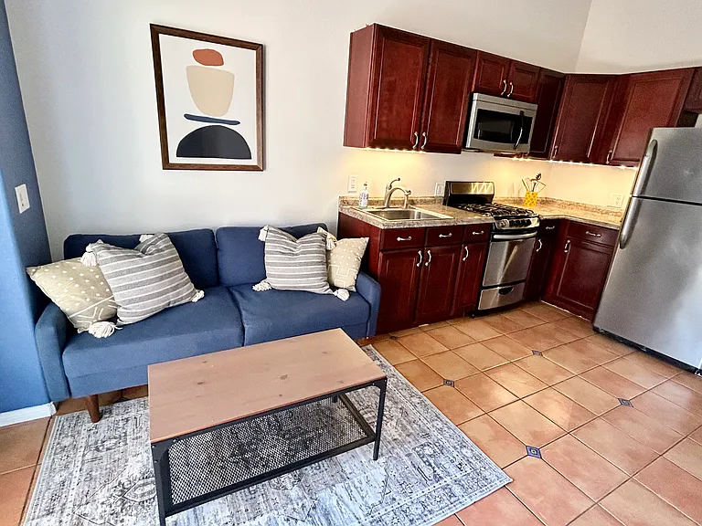 Living room area and full kitchen