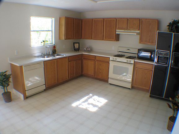 Large eat-in kitchen gets morning sun and afternoon shade. Great view of yard!