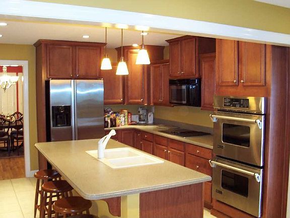 Kitchen also features Corian countertops