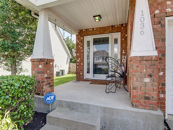 Glass storm front door allows for natural light.