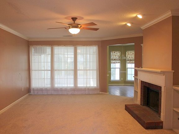 Great Room
						:
						Crown molding, new carpet, ceiling fan, gas log fireplace. Windows face sunroom.