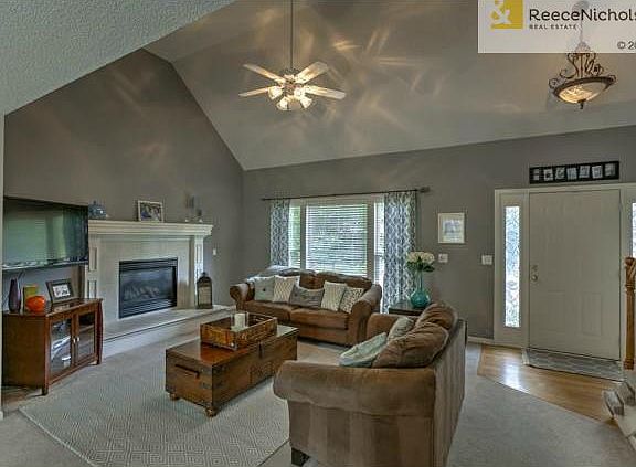 Soaring ceilings and designer wall colors.  Large family room fe